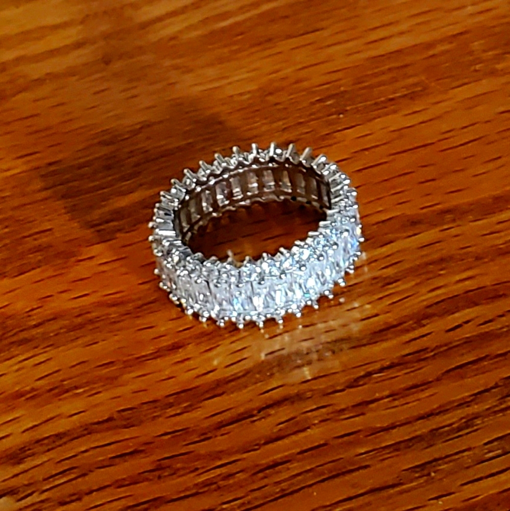 Emerald and round cut eternity ring